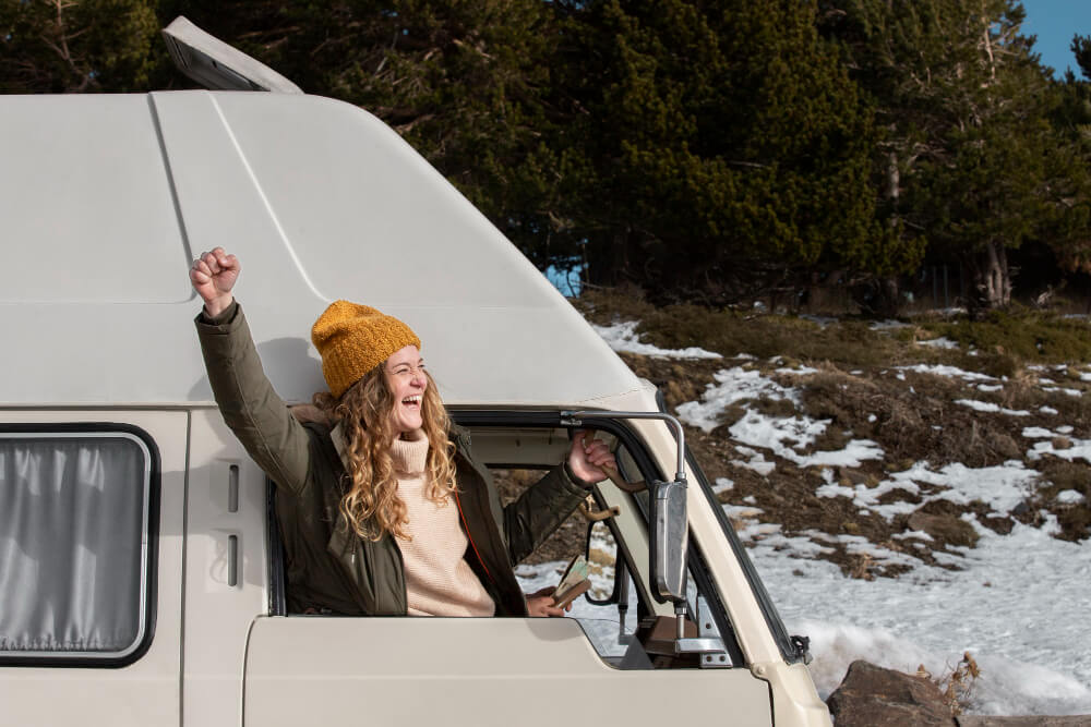 Girl enjoying traveling in a camper